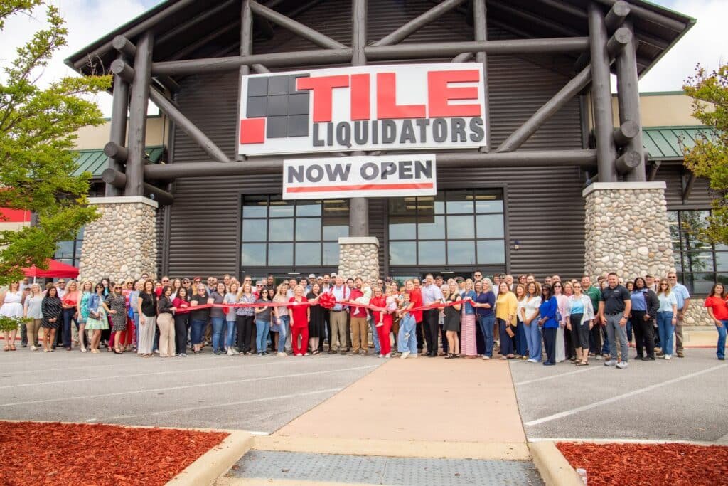 The Tile Liquidators team gathered outside one of the stores