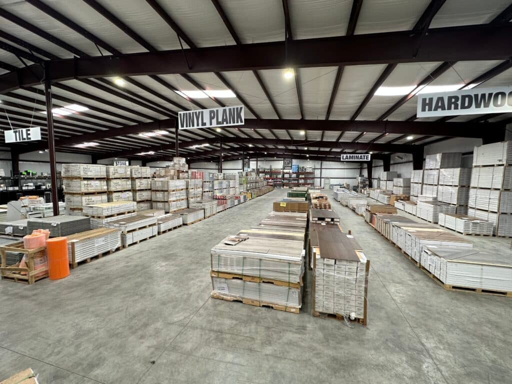 Pallets of in-stock flooring on warehouse racks